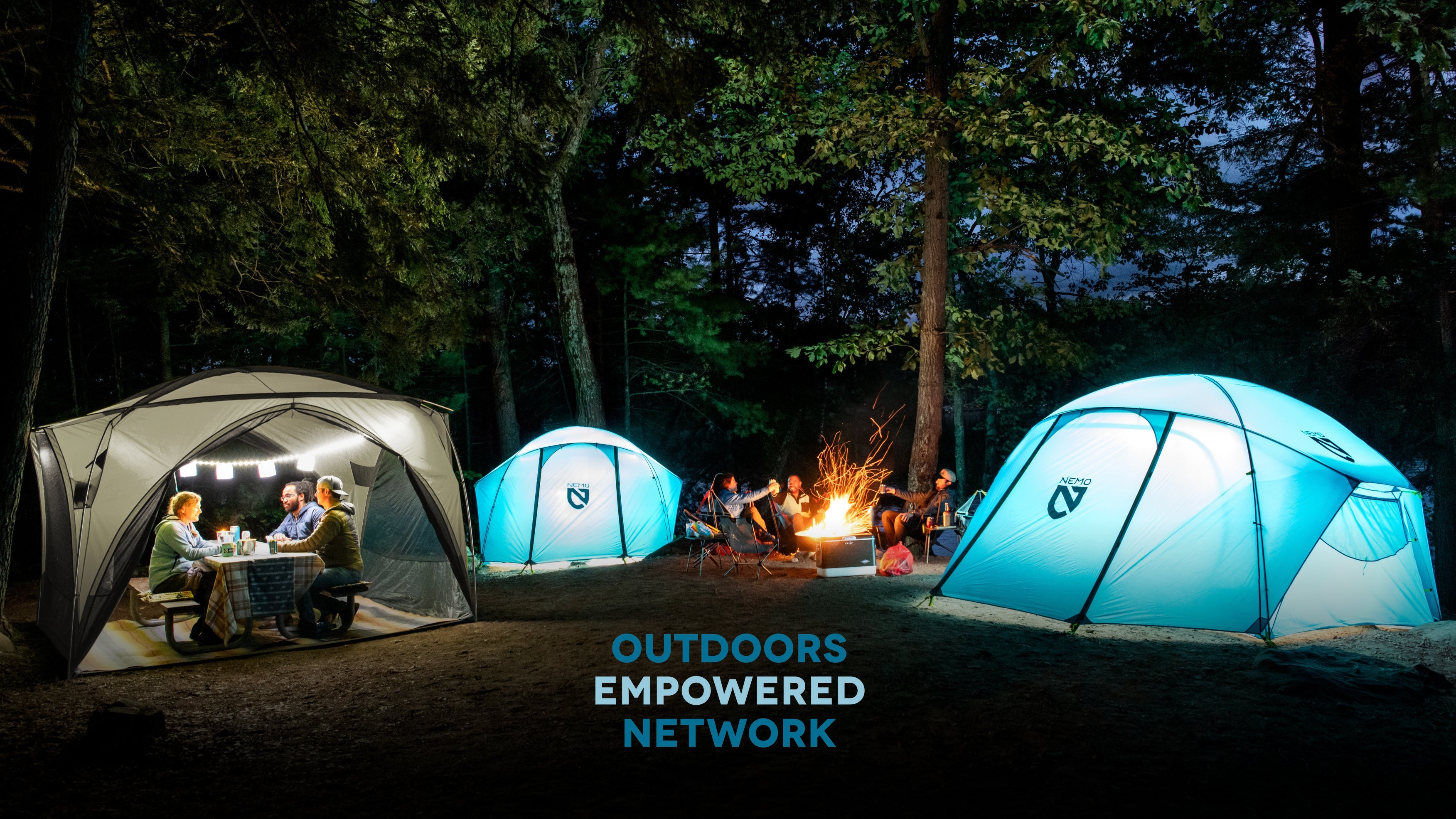 NEMO tents around a campfire